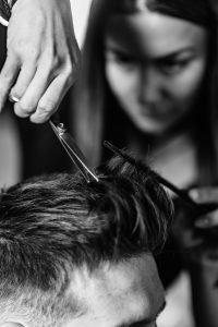Stylist at Intermezzo Salon and Spa in Seattle cutting a man's hair