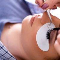 Young woman getting eyelash extension at intermezzo salon & spa in seattle