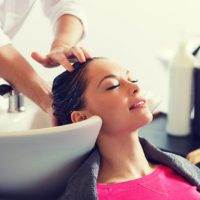 a young women getting her hair shampooed at intermezzo salon and spa in seattle