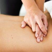 Young female receiving a relaxing back massage at intermezzo salon and spa in seattle
